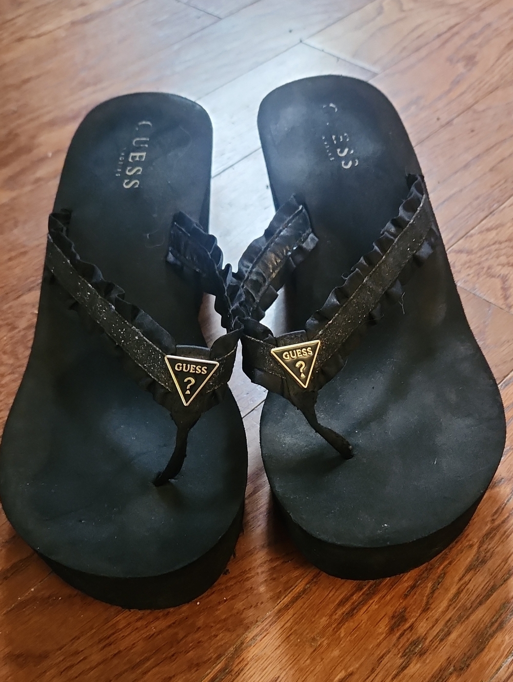 Guess Black Ruffle-Trim Platform Flip Flops with Gold Logo